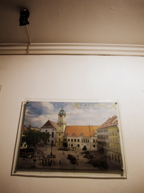 a poster advertising SLovakia (read "Sell-o-fucka" in mandarin) in a dark corridor of a posh hotel